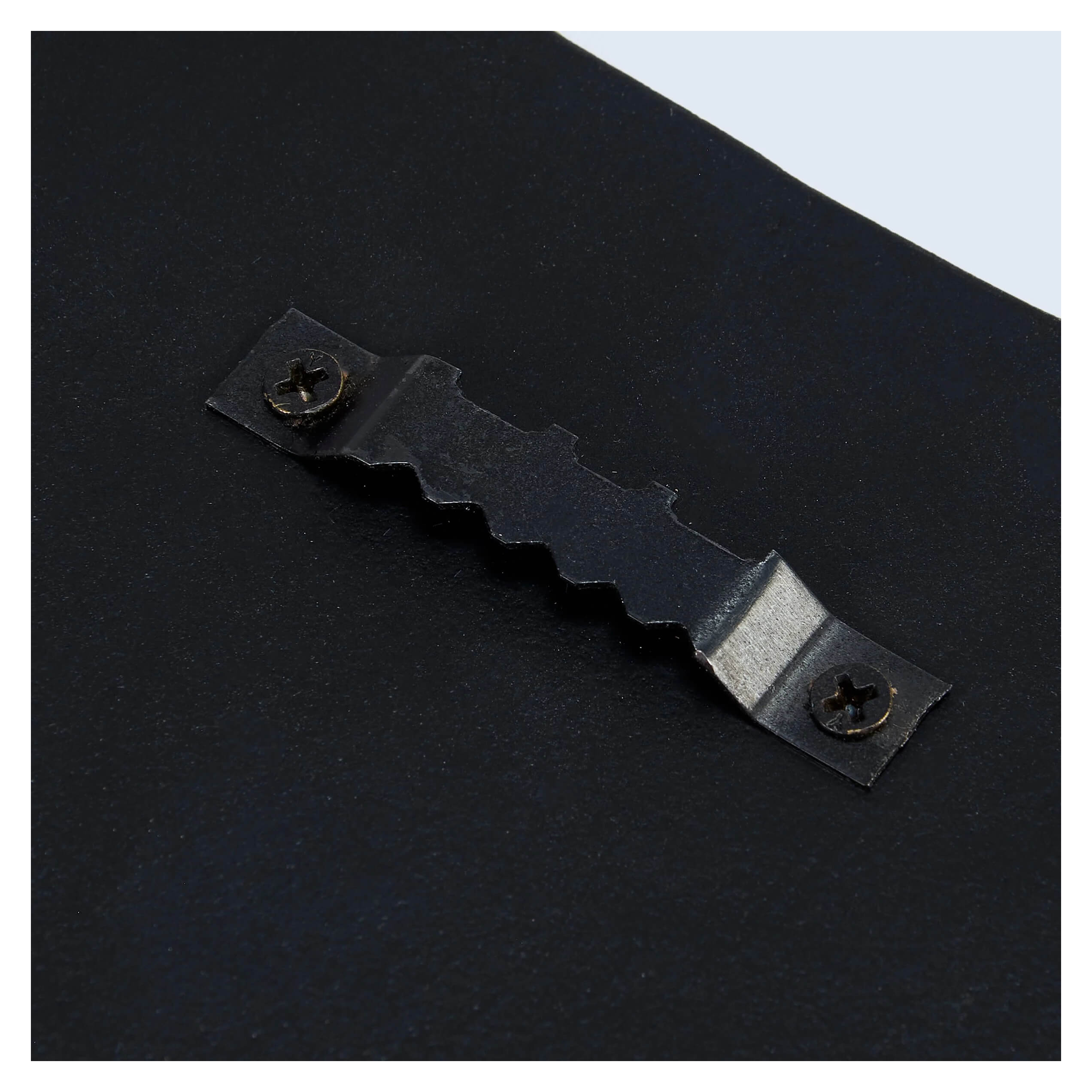 Black metal picture hanging bracket with wavy design and two screw holes for 30 inch large ghost dog porch leaner hanger