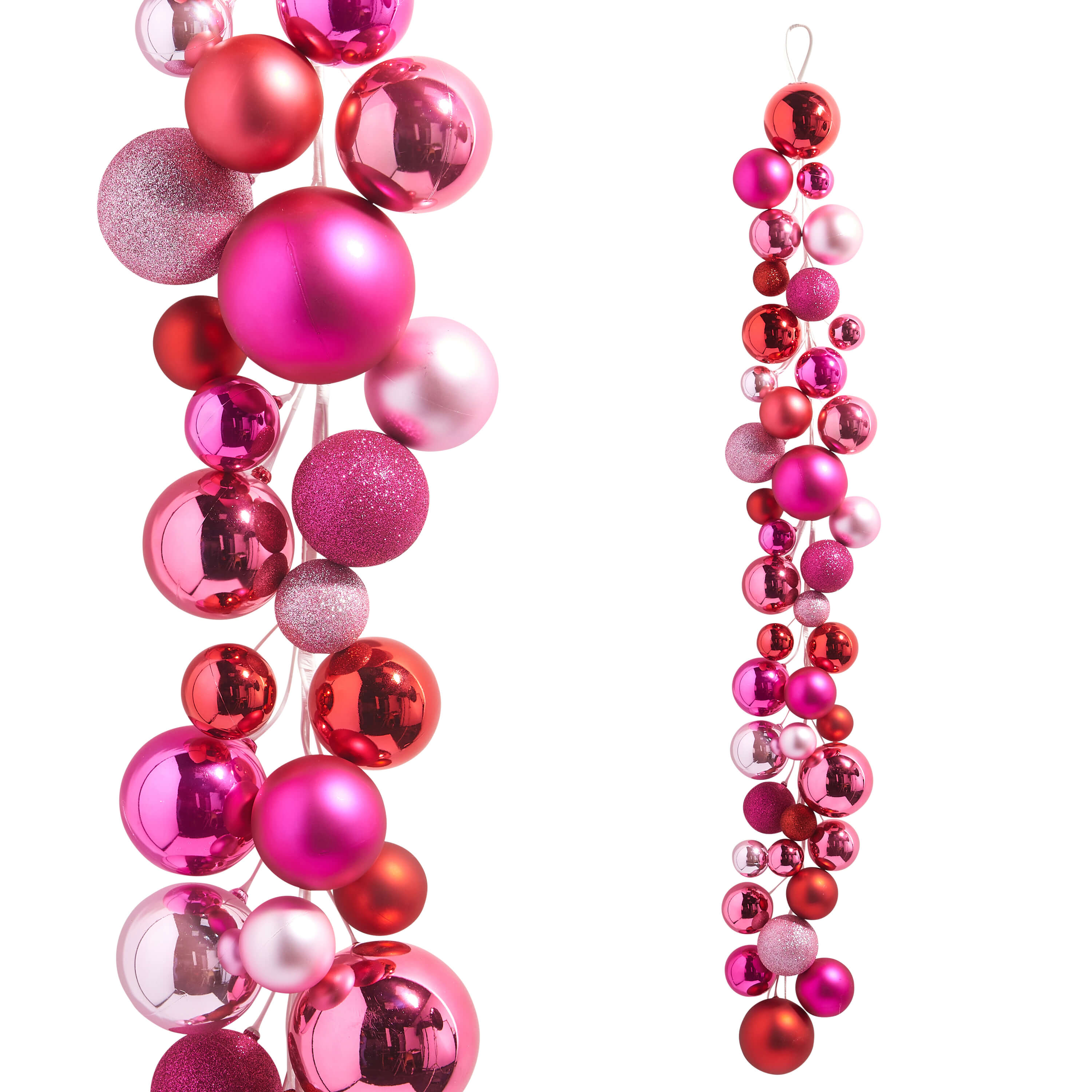 String of colorful Christmas ornaments in shades of pink and red.