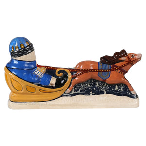Vibrant hand-painted ceramic vaillancourt folk art blue coat santa sleigh pulled by orange reindeer with festive base