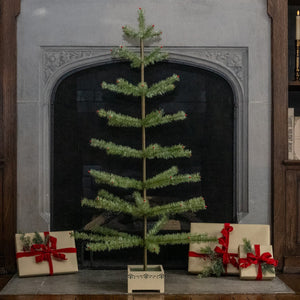 A 48 inch green feather tree with red berries in a white planter, not a pewter tinsel tree or large pewter tinsel tree with beaded tips