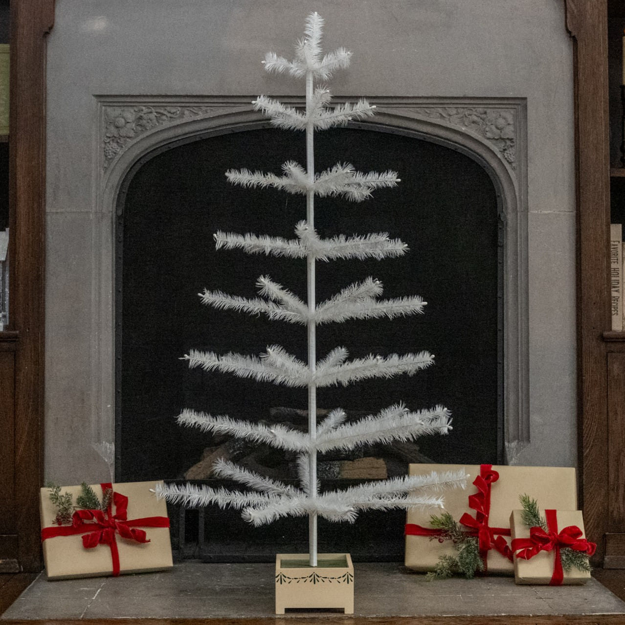 48 ivory feather tree with feathery branches and wood base, a stylish alternative to a pewter tinsel tree