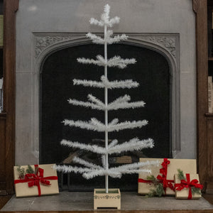 48 ivory feather tree with feathery branches and wood base, a stylish alternative to a pewter tinsel tree