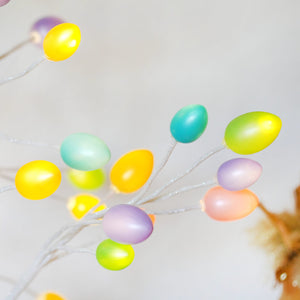 A 48 inch large lighted led pastel egg tree with glossy yellow teal lavender and green eggs perfect for easter lighted decor