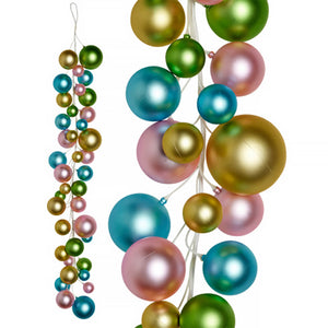 String of colorful metallic Christmas ornament balls in pink, gold, green, and turquoise.
