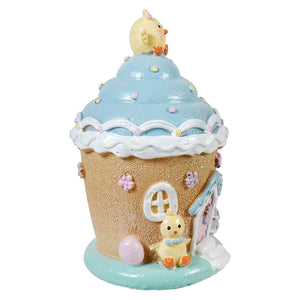 A charming 6.5 inch lighted resin easter ice cream house figurine with pastel blue, beige colors and resin easter chicks