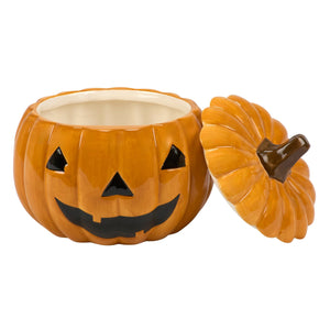 Orange ceramic jack o lantern cookie jar with black triangular eyes nose and smiling mouth for Halloween treats