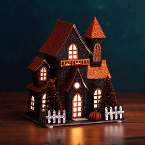 7.5 inch led lighted black glittery halloween haunted house with orange glitter roofs and white picket fence by regency international