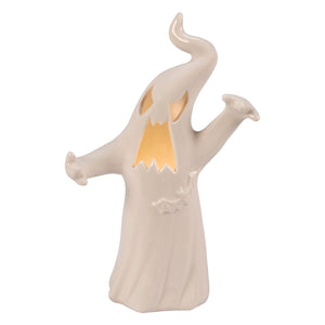 A cream-colored ceramic ghost figurine with glowing orange eyes and mouth perfect for halloween ghost figures decor