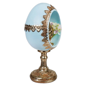 Delicate 7 inch blue gold chick egg with ornate gold leaf and floral arrangement on chick egg pedestal base