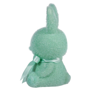 Mint green plush bunny with a satin bow around its neck.