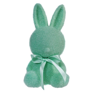 Mint green plush bunny with a matching ribbon bow around its neck.