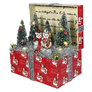 Red vignette box with silver glitter trim featuring lighted miniature frosted christmas trees for christmas tabletop decor