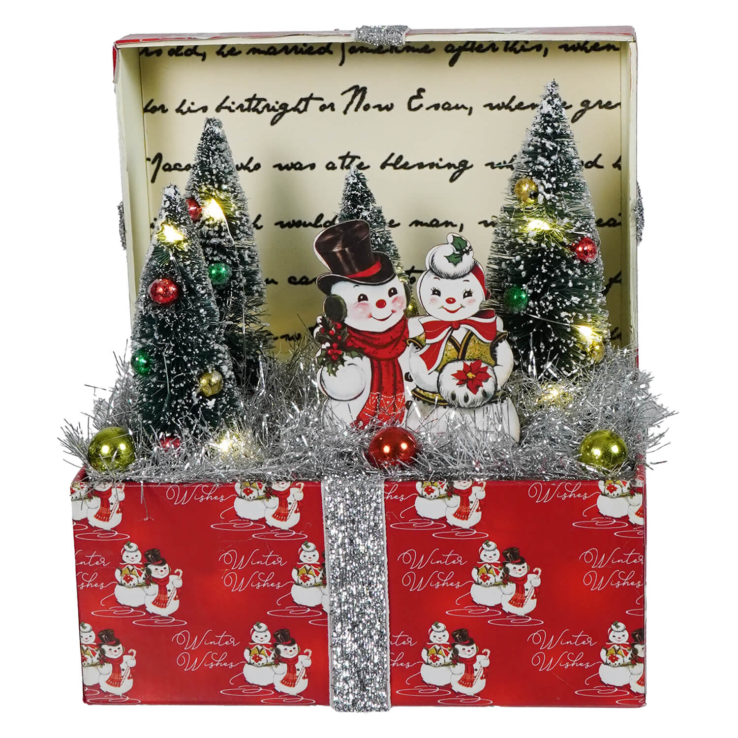 Red lighted vignette box christmas tabletop decor with silver ribbon snowmen and miniature trees winter scene