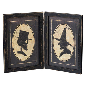 Black distressed wooden double-sided portrait hinged sign with michele kixmiller figural decor skull and witch silhouettes