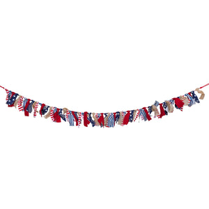 Patriotic red, white and blue fabric garland with tattered strips tied along a string.