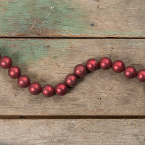 72 jumbo red bead garland features glossy deep red spherical beads with a subtle speckled texture by ragon house