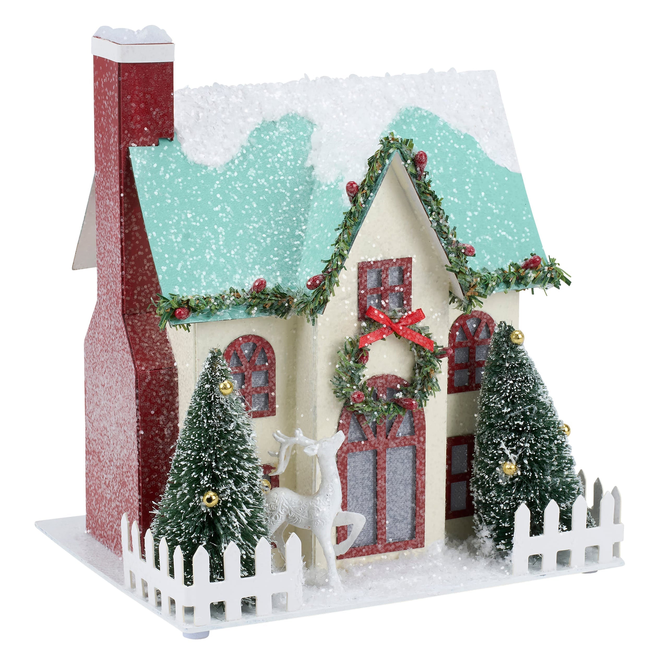 A festive lighted wreath house sitter with cream walls, teal snowy roof, red glitter chimney, and green garlands with red bows