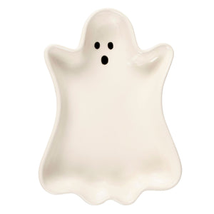 A white ceramic ghost tray with black dot eyes and mouth in a ghost shape perfect for halloween décor