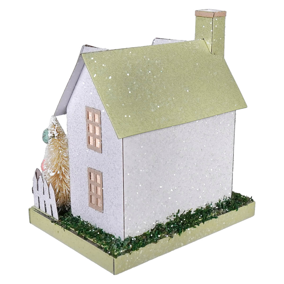 A glittery white and sage green paper bunny easter house ornament with a chimney and lighted led pastel accents