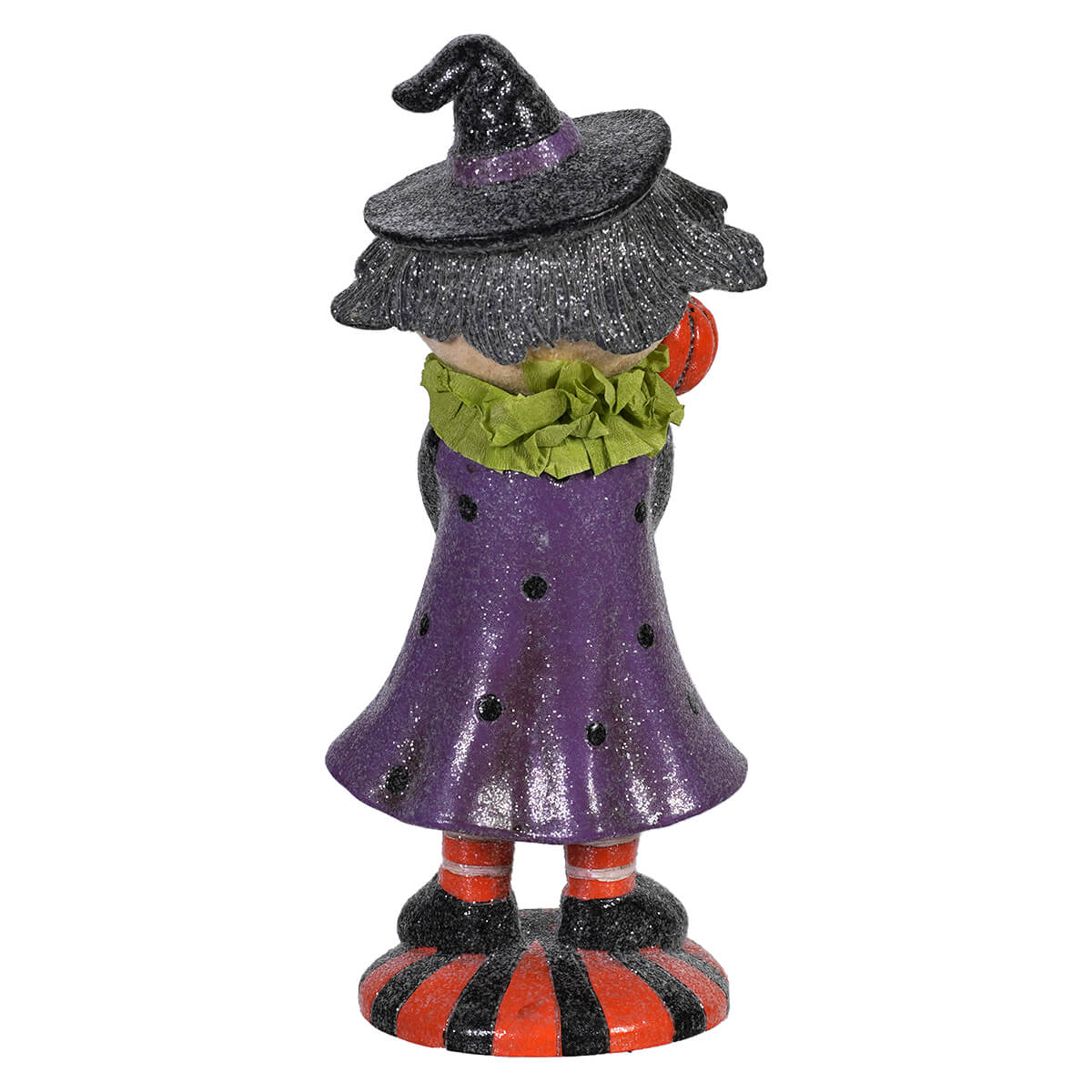 8 inch resin retro witch figurine in a glittery purple dress with a pointed black hat and striped orange black base