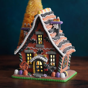 9 inch lighted halloween gingerbread house figurine with red orange facade candy corn roof and glowing windows perfect for halloween village houses accessories