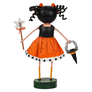 Back side of a stylized Halloween doll figurine with a black head, curly black hair, orange dress, striped legs, holding a star wand and a small black hat on a white background.