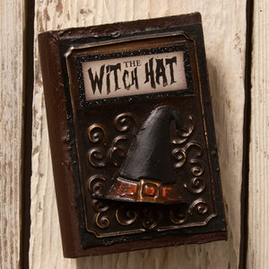 Dark brown ornate book ornament with black witch hat and orange belt perfect for bethany lowe witches decor