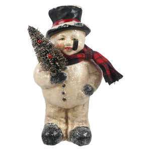 A vintage-style snowman figurine with a glittery beige body, black top hat, red and black plaid scarf, and a small black pine tree, isolated on a white background.