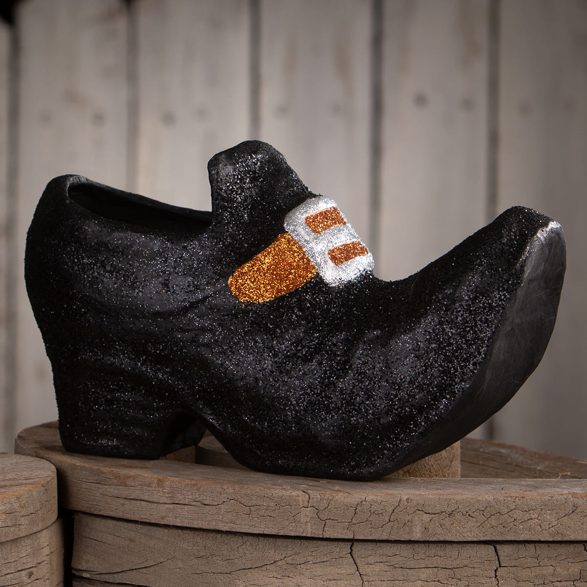 Black glittery paper mache old witch shoe with sparkly orange and silver buckle halloween witches decor