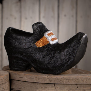 Black glittery paper mache old witch shoe with sparkly orange and silver buckle halloween witches decor