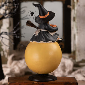 Hattie witch halloween witch decor figurine with black outfit orange-trimmed hat on glossy yellow pumpkin base