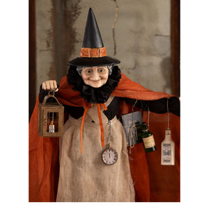 Detailed potion peddler zelda witch figurine with black hat orange sash burlap apron halloween witches decor