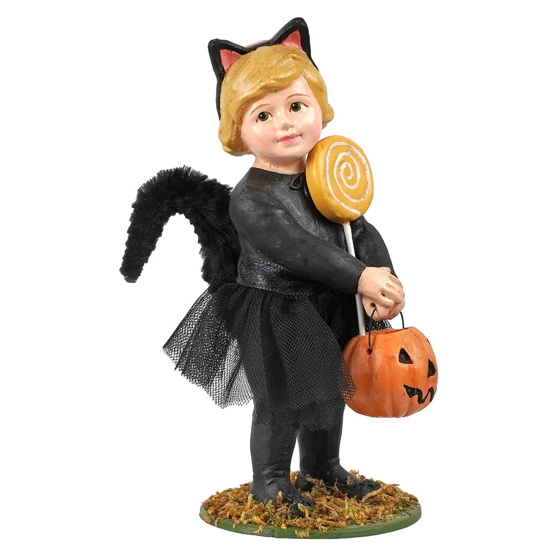 A Halloween figurine of a young girl dressed as a cat, holding a jack-o'-lantern bucket and a large lollipop, standing on a decorative base against a white background.