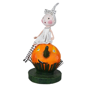 A lori mitchell halloween figurine of a silver haired girl in white dress sitting on an orange jack o lantern for halloween trick or treat children figures