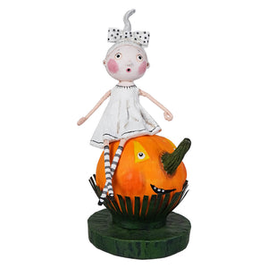 A lori mitchell halloween figurine of a girl with pink cheeks and polka-dot bow on an orange pumpkin perfect for trick or treat kids