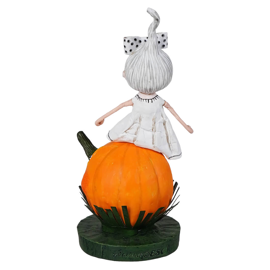A white lori mitchell halloween trick or treat children figure with stitched details on an orange pumpkin base