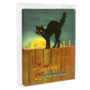 A black cat greeting card features a glowing yellow eyed cat on a wooden fence with a crescent moon in a teal sky