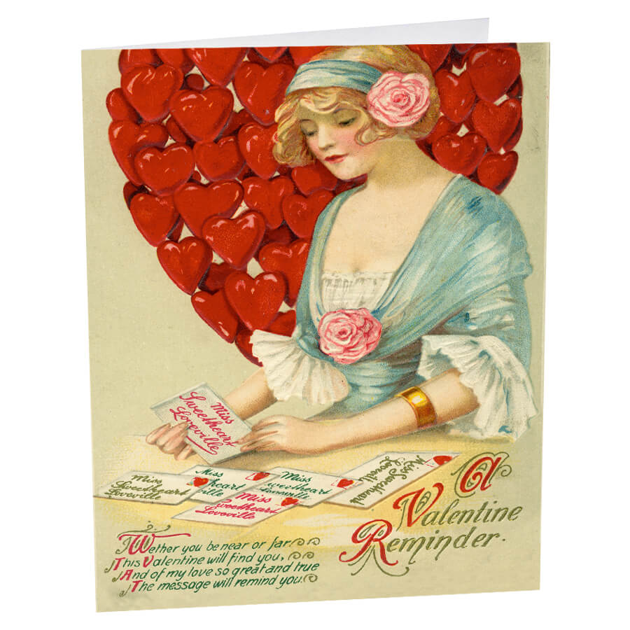 Vintage Valentine’s Day greeting card featuring a romantic illustration with a heart made of smaller hearts and decorative text.