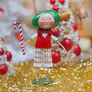 A whimsical all aglow child’s christmas figure with green bulb head, red vest, plaid shorts, holding a candy cane