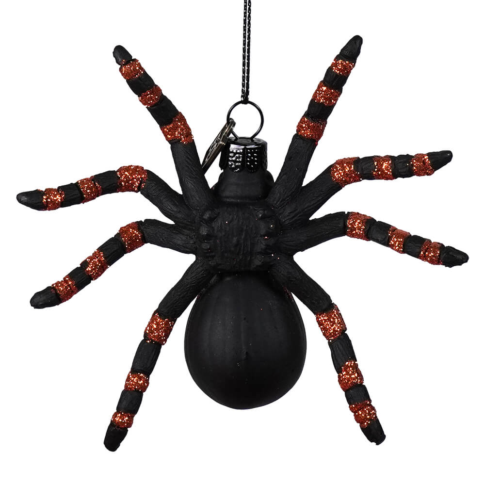 Black spider ornament with glittery orange stripes on legs from eric cortina insect and bug ornaments collection