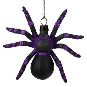 Along came a purple spider ornament featuring a black and purple glittered spider ornament for halloween decorations by eric cortina