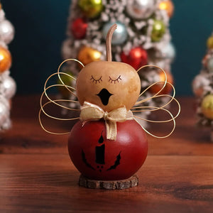 Anastasia tiny angel gourd ornament with red and beige colors gold wire wings and golden bow tie from meadowbrooke gourds