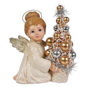 A glittery white bethany lowe angel figure with gold wings holding a miniature christmas tree for holiday decor