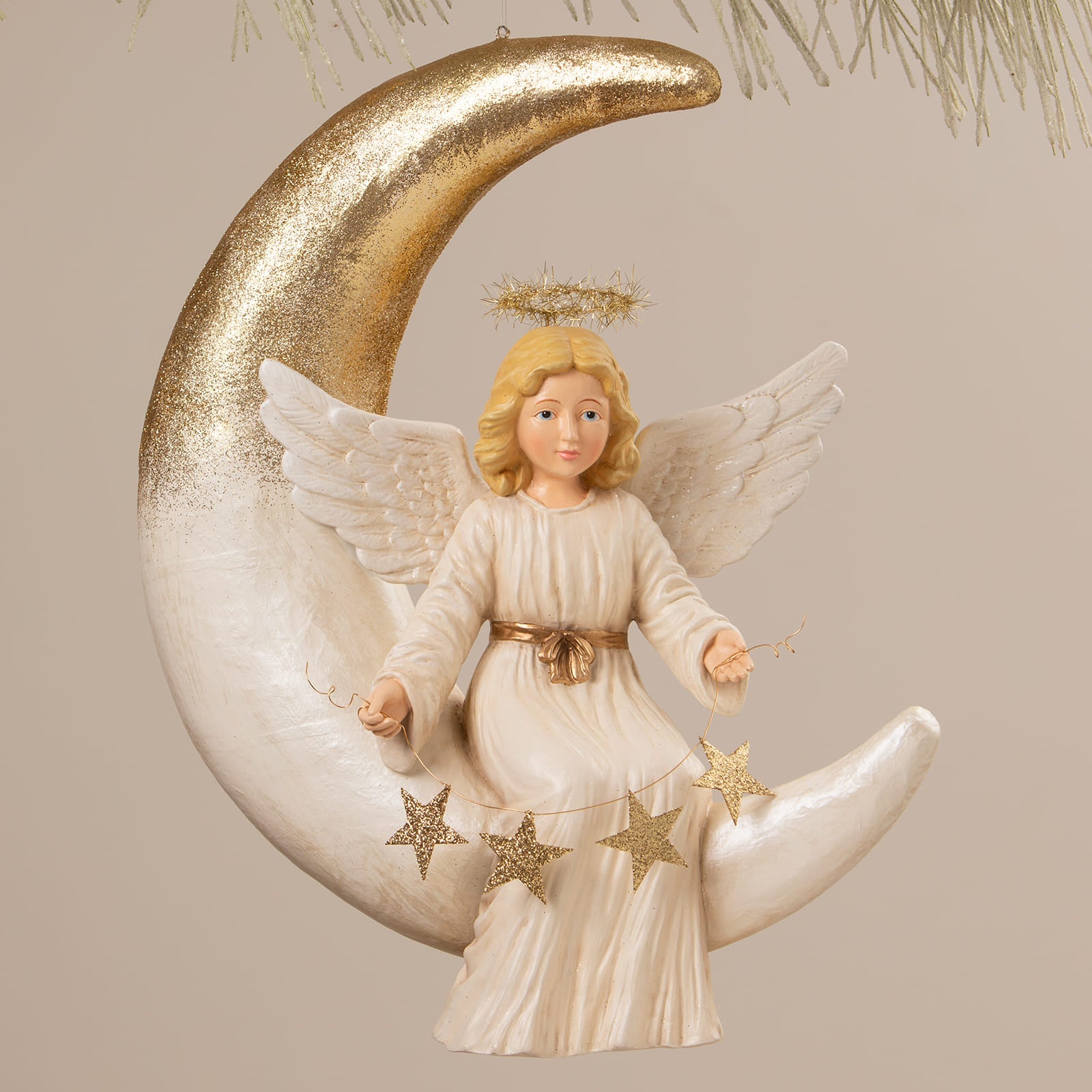 Angelica on moon angel figure by bethany lowe design with blonde hair white wings cream gown gold accents on crescent moon
