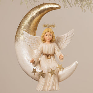 Angelica on moon bethany lowe design angel figure with white wings gold belt holding golden star ornaments on glittery moon