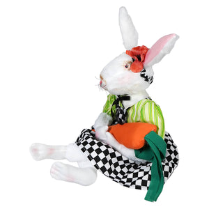 A plush fabric doll angora white rabbit wearing green striped shirt and checkered skirt with softly embroidered face