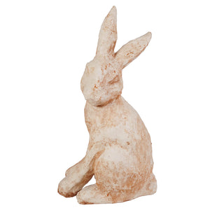 A rustic antique waxed ivory sitting rabbit figurine with textured finish and long upright ears