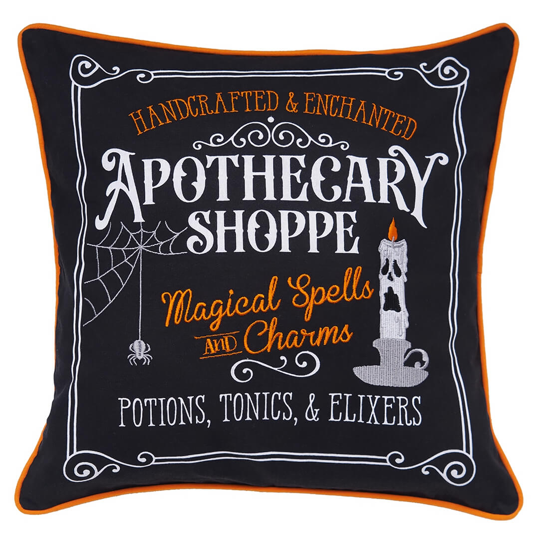 Decorative Halloween-themed throw pillow with ’Apothecary Shoppe’ text and spooky design elements.