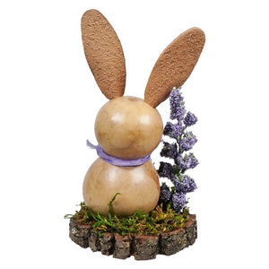 A rustic bunny gourd scene with cork ears and lavender on a mossy base by meadowbrooke gourds