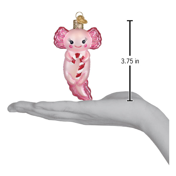 Pink glass axolotl ornament with glittery pink fins holding a candy cane and gold hanging loop figural decor